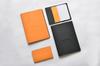 Rhodia A5 Epurée Black Notebook with Cover (A5 Stapled Notebook with 5mm Grid and Orange Lines) (RHODIA cf118159)