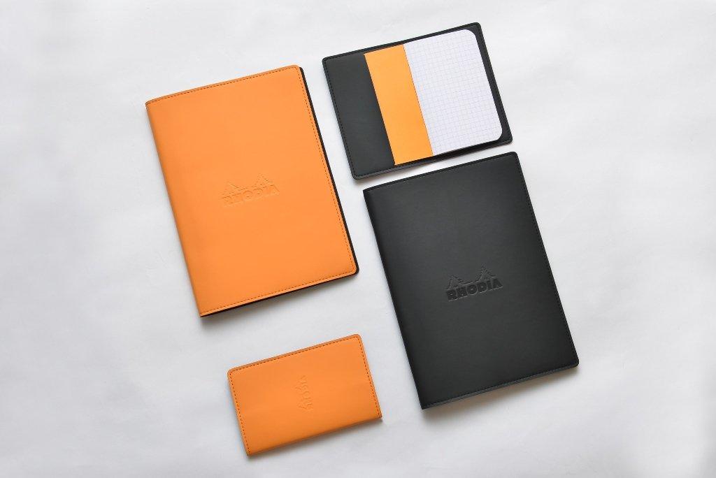 Rhodia A5 Epurée Black Notebook with Cover (A5 Stapled Notebook with 5mm Grid and Orange Lines) (RHODIA cf118159)