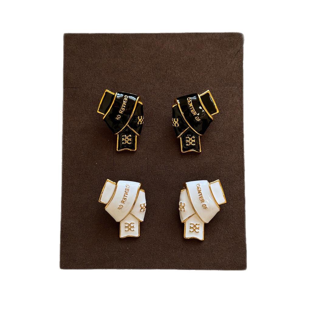 Black & Gold Enamel Twist Earrings: Versatile Luxury Studs for Autumn/Winter 2025