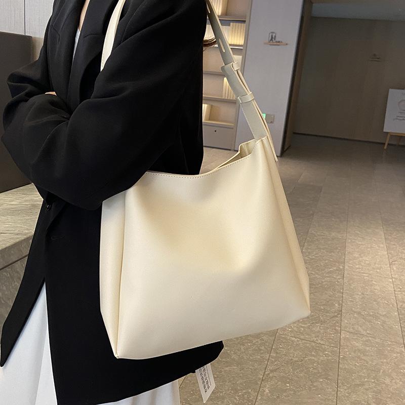 Spring simple style casual solid color wide shoulder strap mother and child bag commuting versatile niche design women's shoulder bag