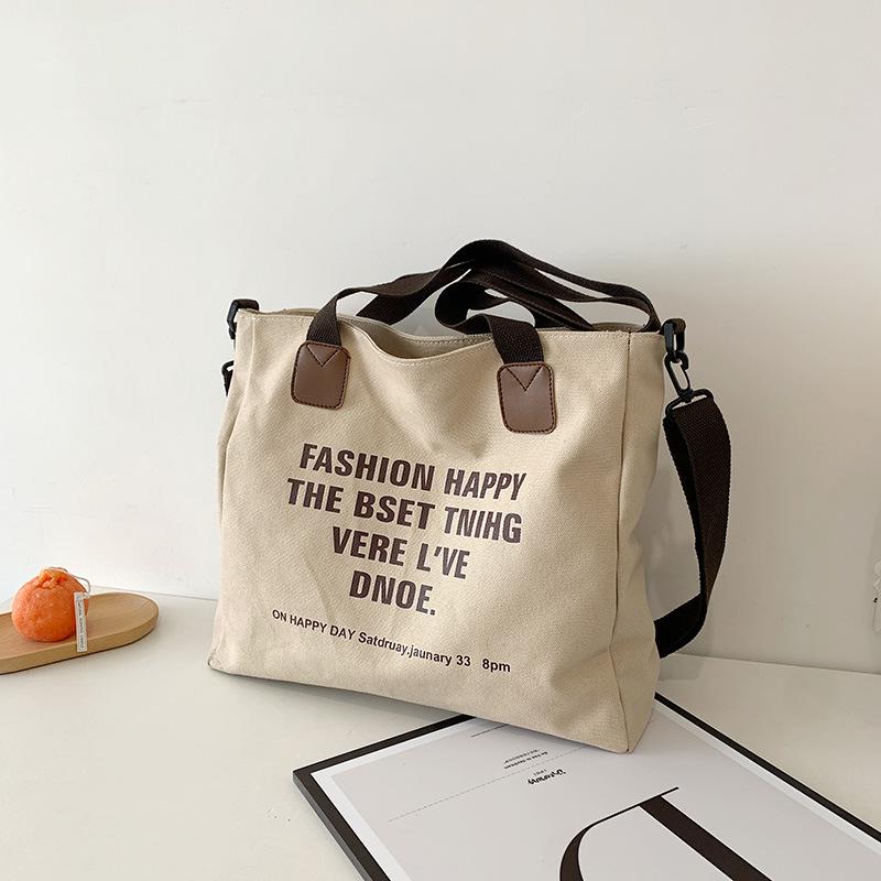Simple canvas large-capacity casual bag women's 2025 new lazy style single shoulder fashion printed letter tote bag