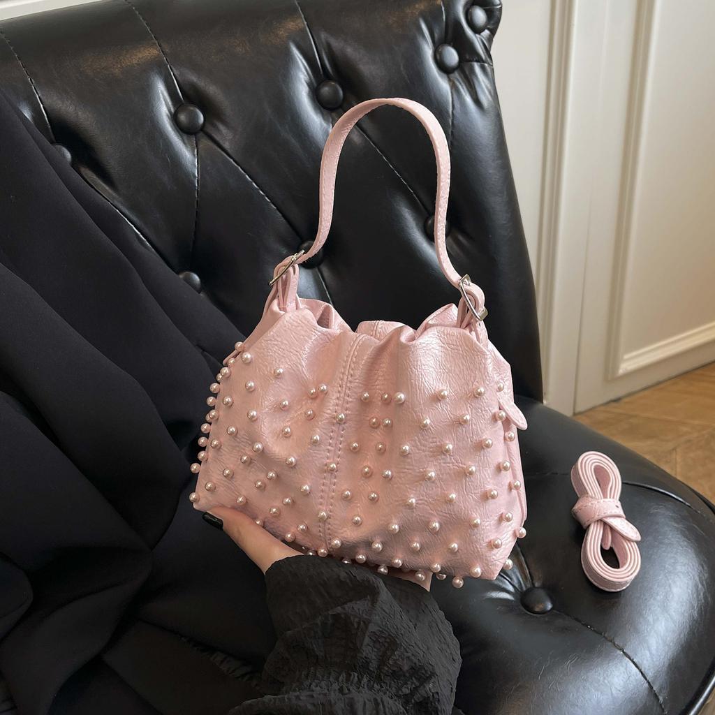 Trend European and American fashion rivets spring and summer armpit women's bags simple and versatile portable bucket bags single shoulder oblique spa