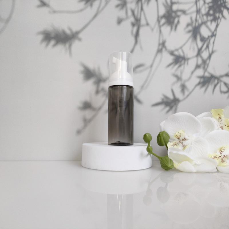 Available 60ml Transparent Black Foam Mousse Bottle for Face Wash and Travel-friendly Cosmetic Packaging.