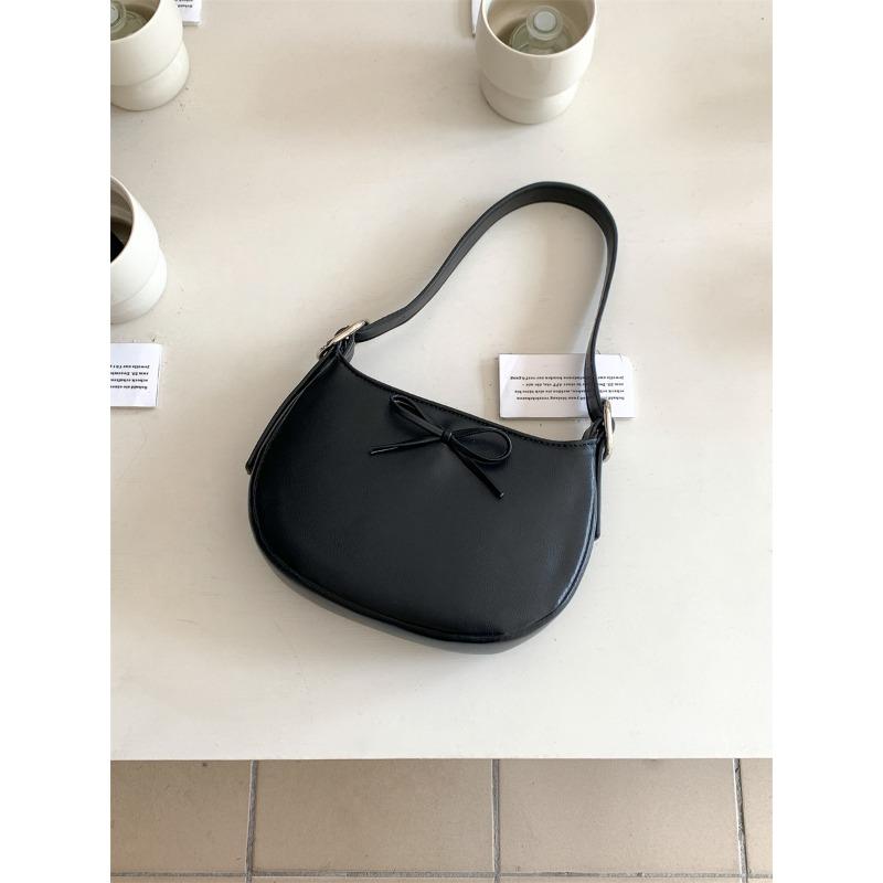 Niche style underarm bag women's oval simple small handbag fashion bow spring and summer new shoulder bag women
