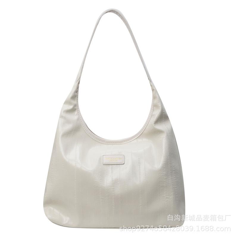 Large-capacity commuter armpit bag women's 2025 new trendy temperament explosive large bag simple shoulder tote bag