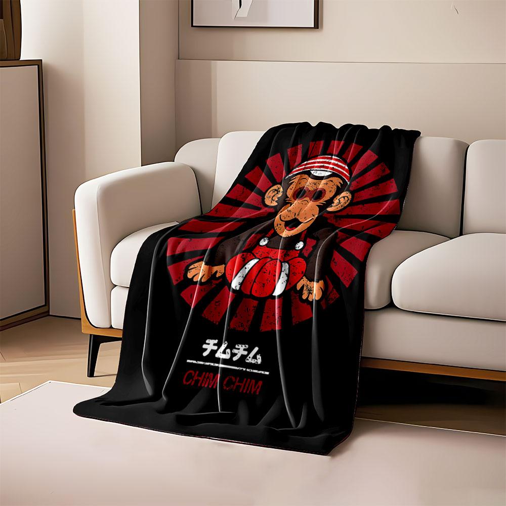 

A cartoon monkey with a striped hat, red outfit, and radial red background. for all seasons blanket lunch break throw gift 80cm x 120cm