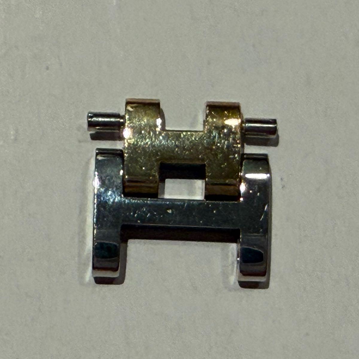 Used Hermes Clipper piece, glossy surface, old style screw, 1 piece