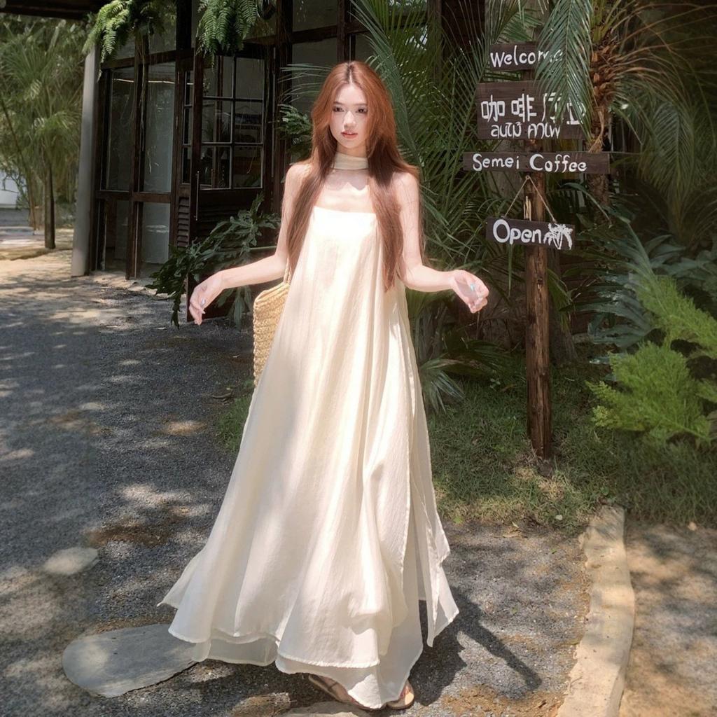 French high-end streamer temperament suspender dress women's summer loose and thin drape skirt seaside vacation dress