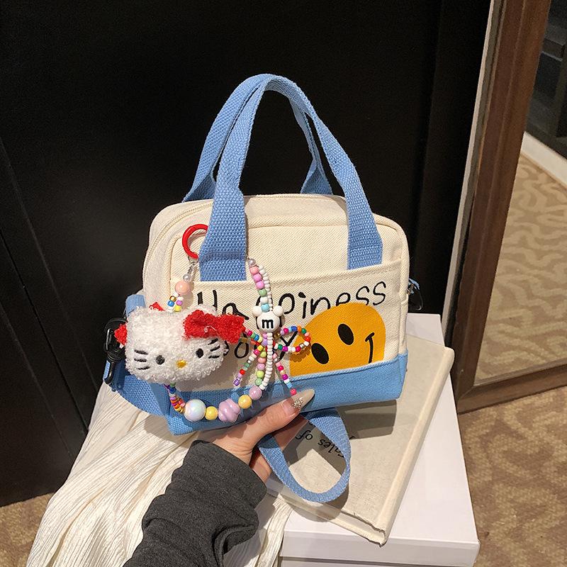 Cute spring girl handbag hand carry out niche small square bag Korean version fashion trend shoulder messenger bag