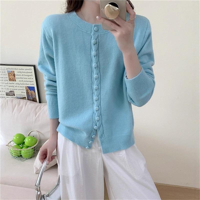 Autumn new solid color round neck single-breasted splicing long-sleeved knitted sweater women's fashion age-reducing top
