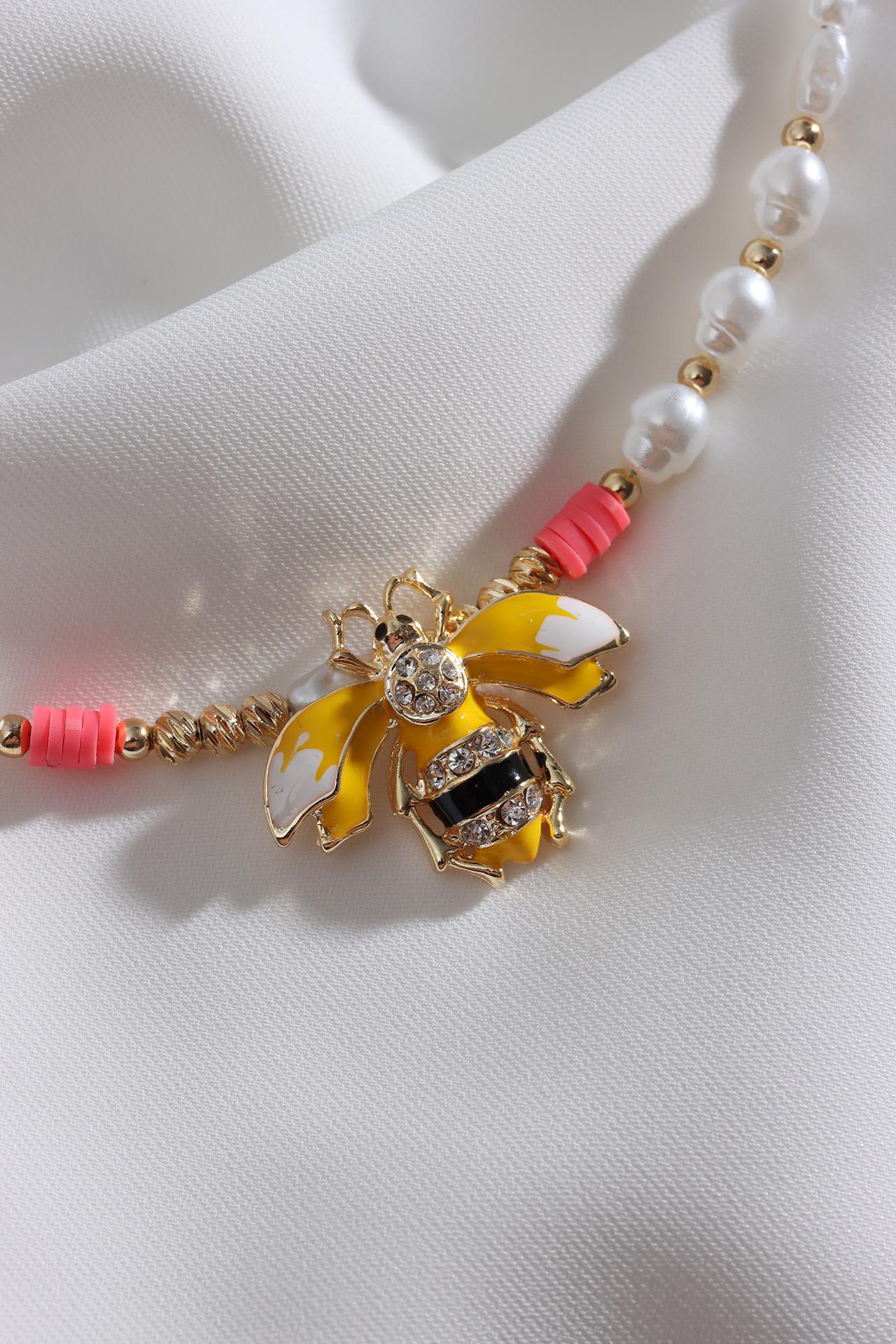 

Жемчужное ожерелье Fimo с фигуркой пчелы и цветком граната