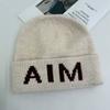 Niche personalized letter knitted hat children's autumn and winter new wool hat warm ear protector bag head cold hat