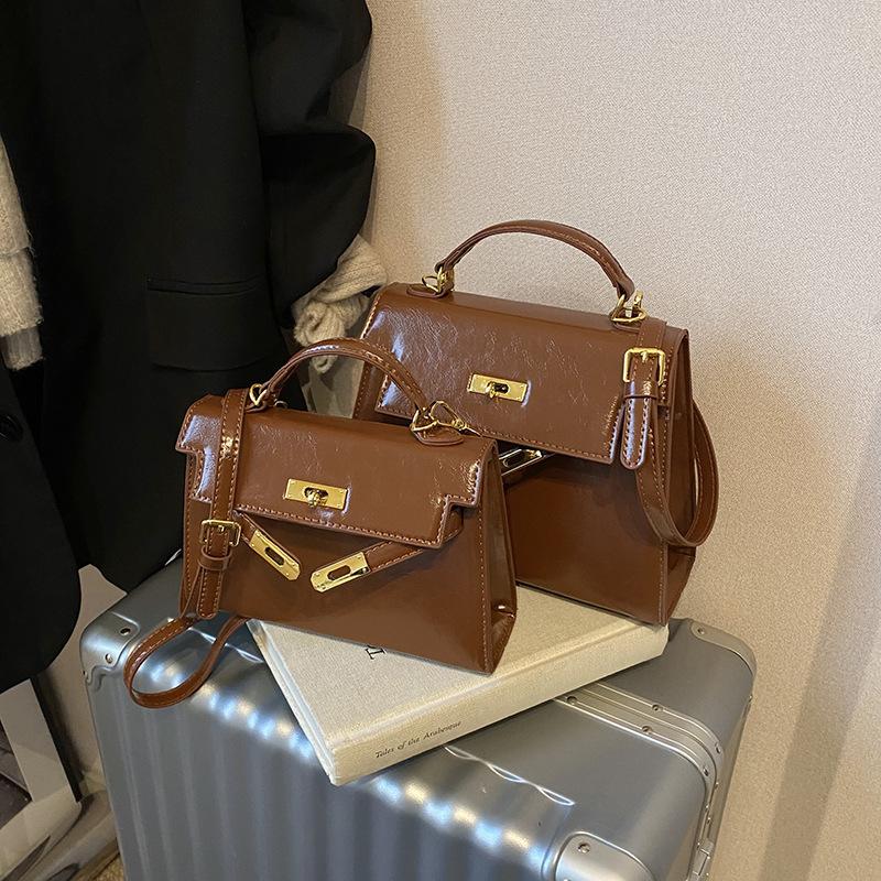 

Трендовый новый продукт ретро светлая роскошь высококлассная портативная сумка Kelly модная женская повседневная универсальная сумка через плечо/мессенджер Small 21.5 * 6.5 * 14 коричневый