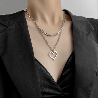 Mode tendance collier superposé double couche portant un amour creux nouveau tendance niche personnalité chaîne de clavicule hip-hop pour hommes et femmes