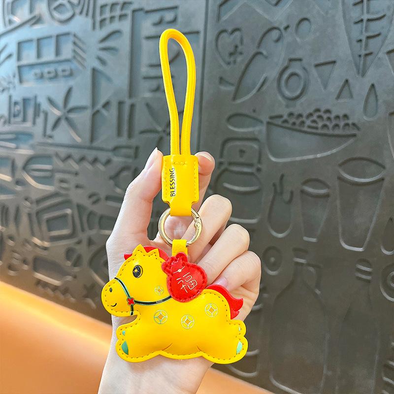 

Year of the Horse mascot leather lucky bag horse keychain will be rich soon bag pendant New Year s Day creative small gift жовтий