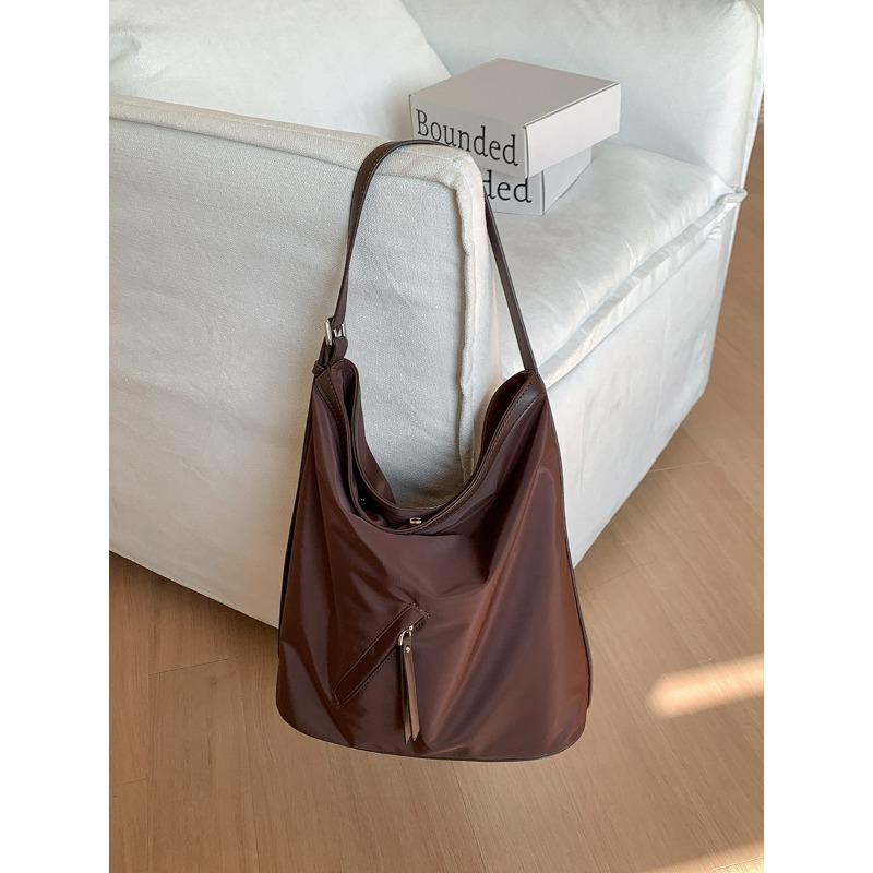 

Simple tote bag large capacity women s new commuter bag women s high-end leather splicing nylon shoulder bag women кофейный