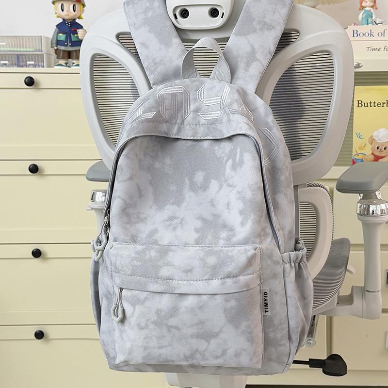 Schoolbag Japanese simple and versatile large-capacity solid color campus schoolbag 1011 summer new light commuter student backpack