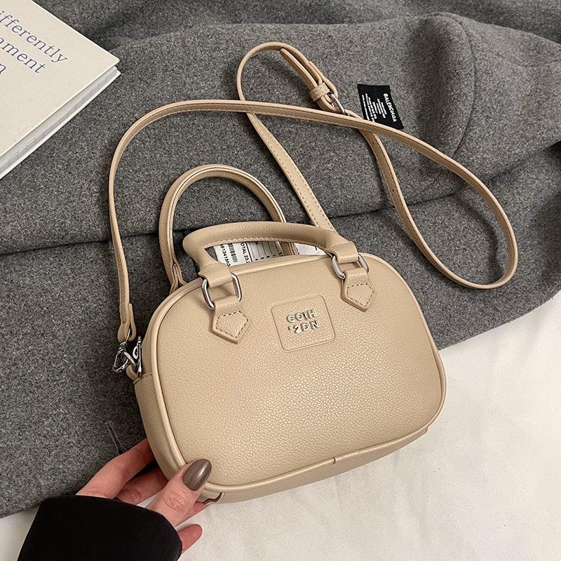 

Ранневесенняя горячая распродажа французская нишевая модная портативная сумка для боулинга однотонная универсальная темпераментная с продвинутым чувством сумка-мессенджер женская