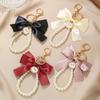 Popular Large Bow Pearl Keychain: Colorful Woven Ribbon Earphone Case Key Gift
