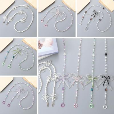 Lanière de téléphone perles nacrées nœud papillon Anti-perte Chaîne de téléphone perlée Sangle bandoulière téléphone portable colorée universelle Porte-clés Pendentif