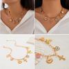 Stylish Gold Crosses Necklace for Women with Seashells Charm Decoration for Beach and Summer Fashion Statement Pieces