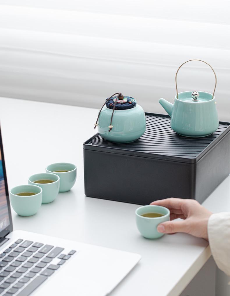 Portable Ceramic Kung Fu Tea Set: Teapot with Handle and Four Cups for Travel and Business Gifting