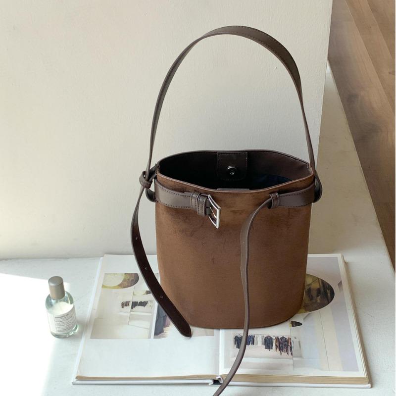 Autumn and winter new suede bag retro cylinder bucket bag women's niche leather buckle portable shoulder bag