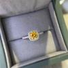 Yellow Moissanite Square Bag Style Ring with Gold Finish, Certified Moissanite Diamond, and Black Card.