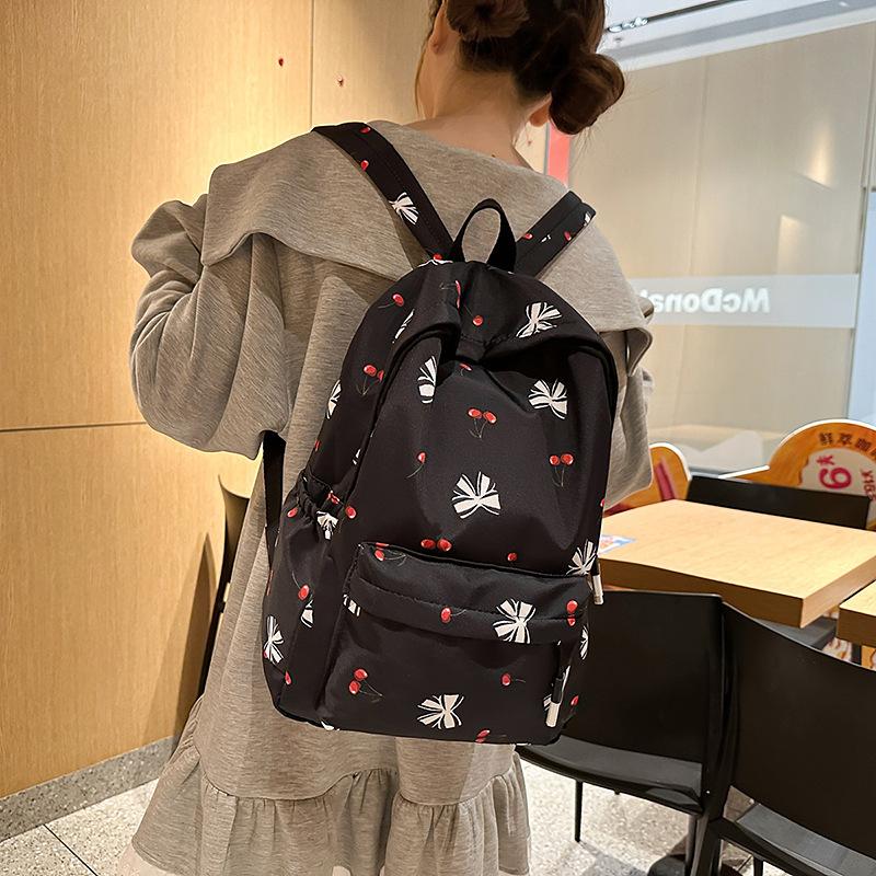 Korean small fresh schoolbag female college student simple small floral backpack lightweight large capacity high school backpack