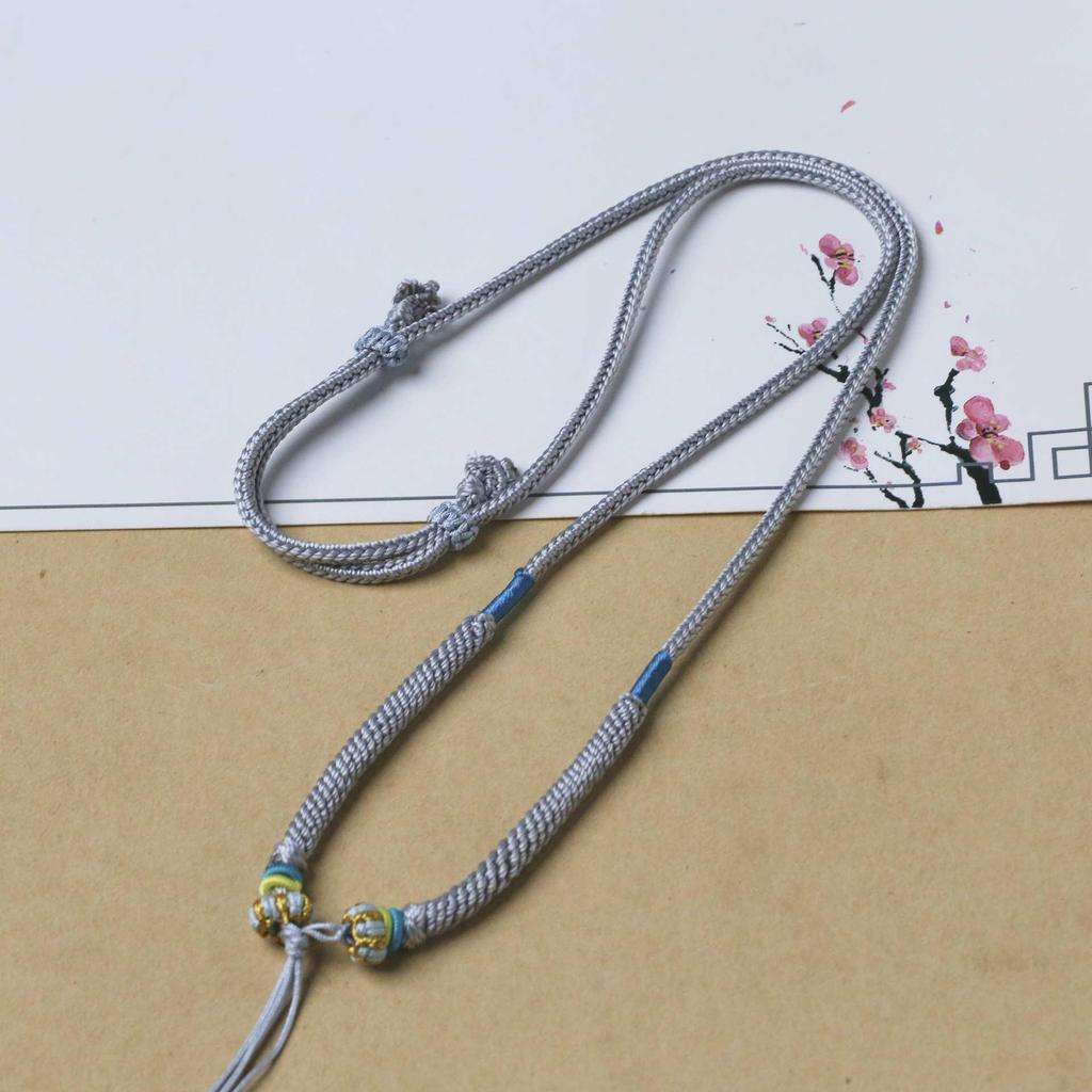 Adjustable Pendant Necklace with Handmade Woven Cord, Featuring Jadeite, Amber, Nanhong, and Hetian Jade Stones.