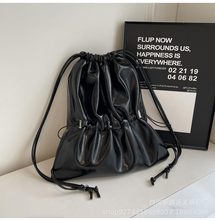 

Silver student backpack ins Korea s new 2025 summer drawstring bundle casual simple large-capacity backpack