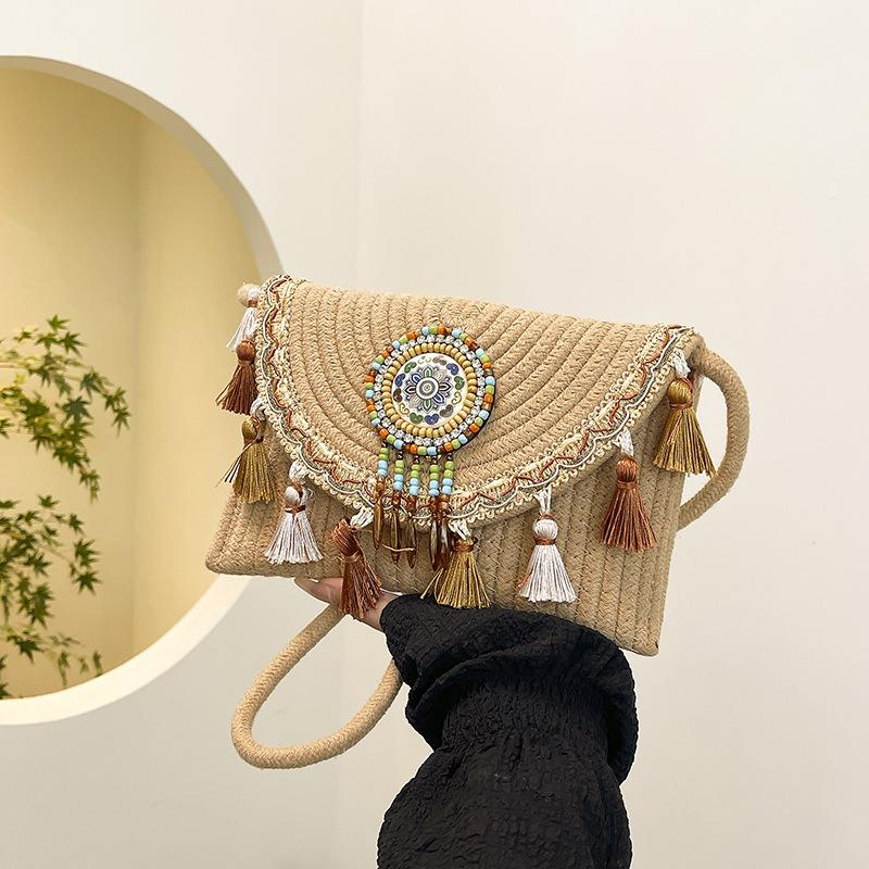 National beach woven bag women's summer new contrasting color fringed straw woven casual shoulder messenger bag