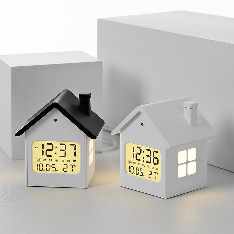 Hausförmiger Multifunktionaler Kinderwecker mit Nachtlicht und LCD-Anzeige.