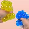 1 Stück weicher Trauben-Netz-Stressball, Dekompressionsball, Stressabbau, sensorischer weicher Ball, Handübungs-Elastikball (Zufällige Farbe)
