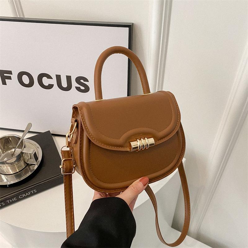 Primăvară nișă modă unidirecțională populară culoare solidă geantă de mână nouă tendință simplă oblică geantă de șa pentru navetiști