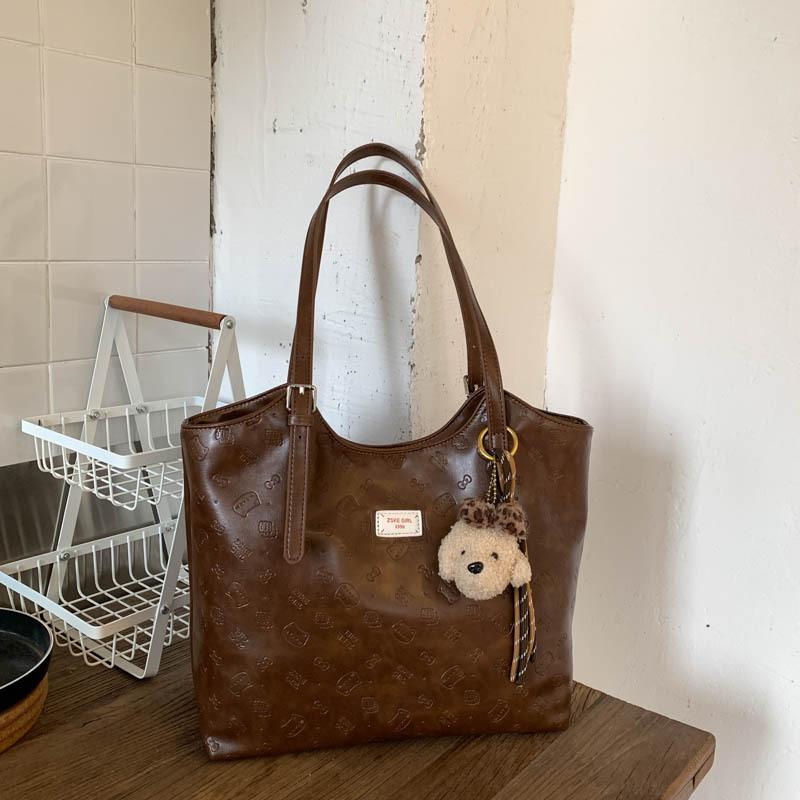 

This year, large-capacity bags are popular for women s 2025 autumn new fashionable and simple portable shoulder bags, commuter tote bags. no pendant коричневий