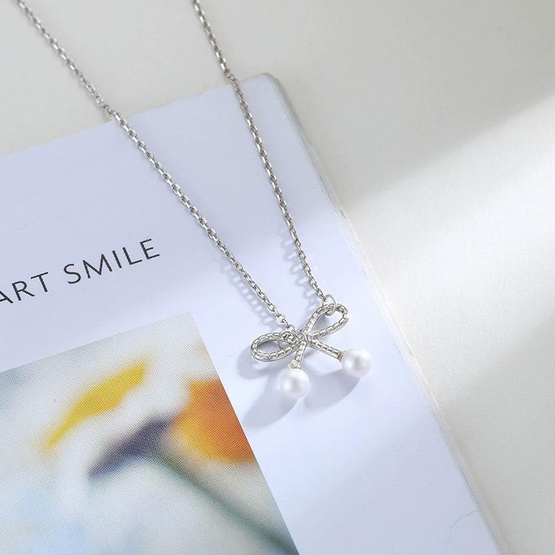 

Ожерелье с жемчужным бантом Женское ожерелье с холодным ветром на ключицу Нежная фея