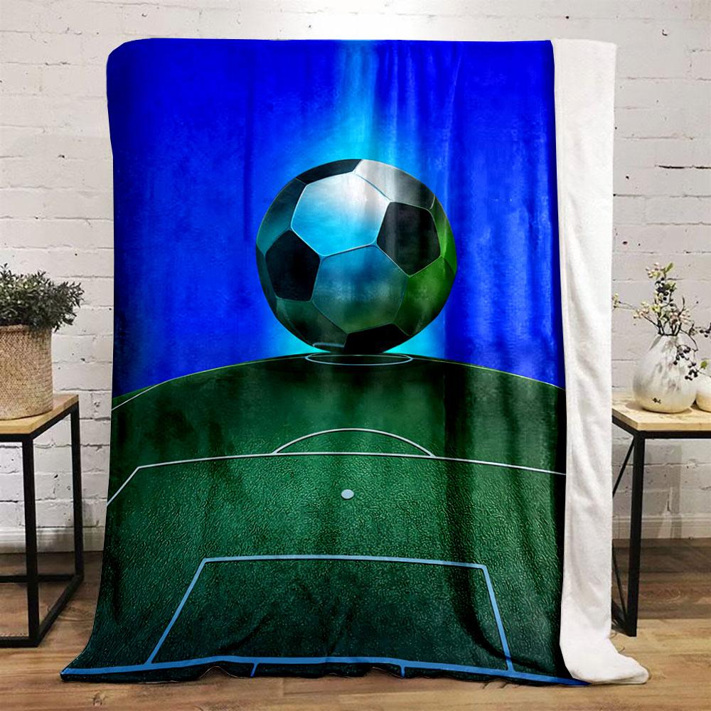 A soccer ball hovers above a green field with glowing blue background. for all seasons blanket lunch break throw gift