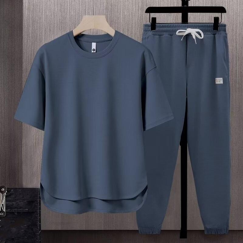 

Мужской летний повседневный однотонный комплект из двух предметов: футболка с короткими рукавами и брюки 3XL серый