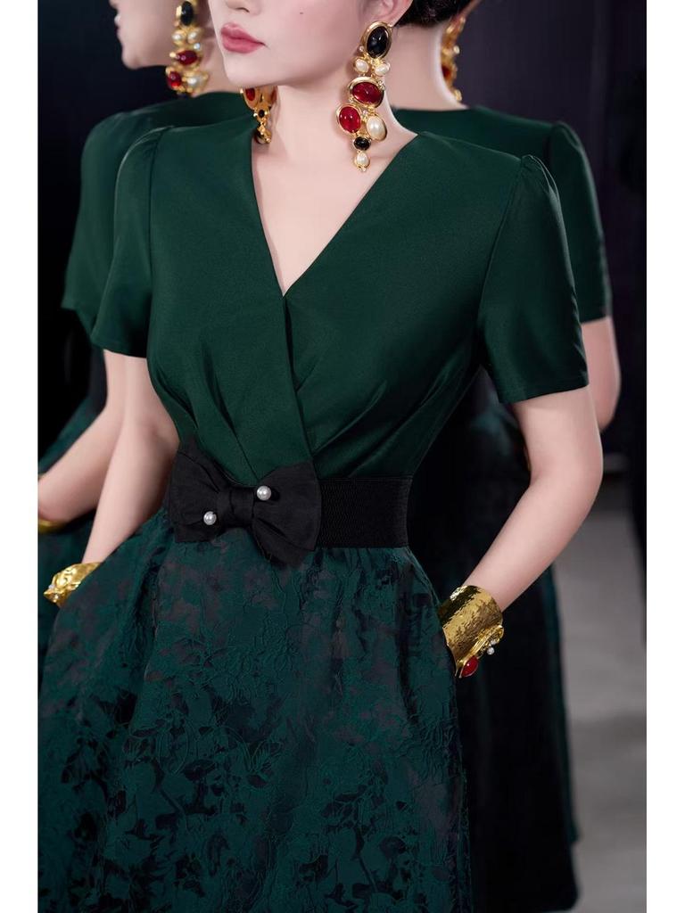 French Spring/Summer 2026 Women's V-Neck Black Bow Tie Jacquard Dress with Waist-Cinching and Wide Hem.