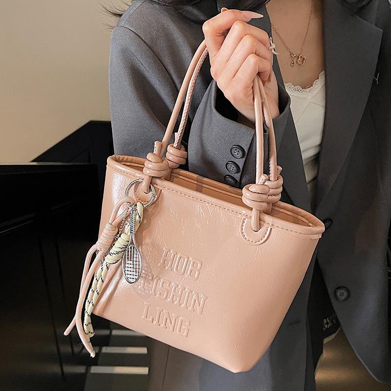 2025 popular new niche simple wind hand carrying bucket bag Korean version casual versatile commuter fashion messenger bag women