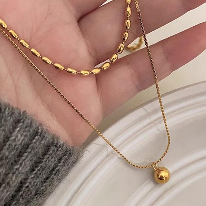 

Минималистичное двухслойное ожерелье из титановой стали с золотыми бусинами - Наслаиваемое, Ретро, Изысканная женская цепочка