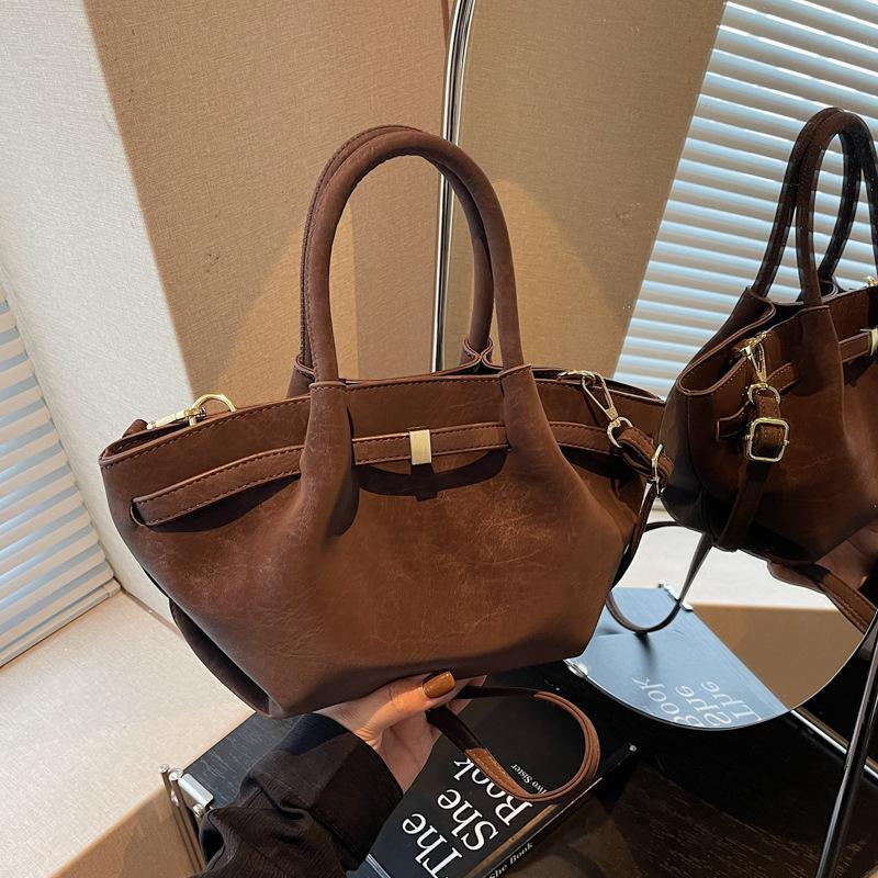 

Retro underarm bag women s new spring and summer high-end sense portable shoulder crossbody bag pattern commuter bag темно-коричневого