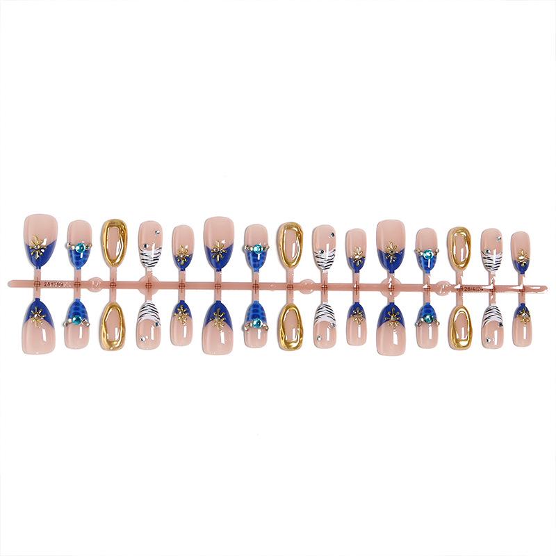 Almond-Shaped Gilded Press-On Nails with Blue Gem Accent