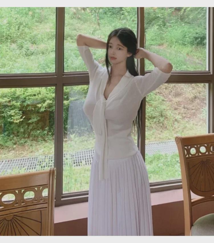 Koreanischer Dongdaemun Slim Fit Strickpullover mit halblangen Ärmeln und Schleifendesign für Damen