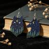 Vintage Cross Earrings: Two-Tone Carved Wolf Design