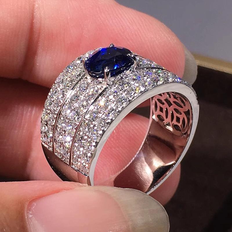 Huitan Funkelnde Damenringe mit ovalem blauem Zirkonia Breiter Ring Wunderschöne Hochzeitsaccessoires Farbe Silber Strahlender Modeschmuck