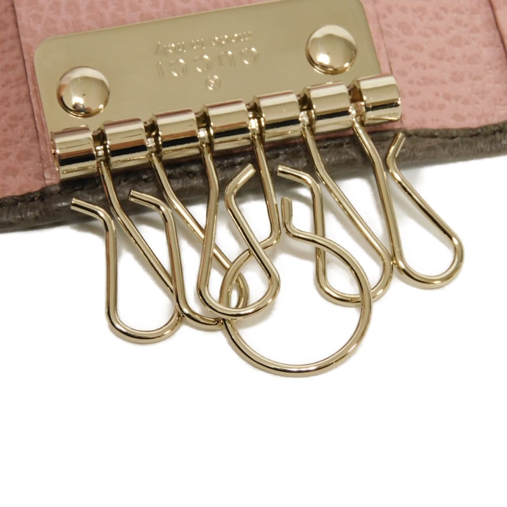Used 6-ring keychain (product numbers 9539, 354499, CAO2G, 2160, 7949) in pink with a two-tone snap button and cursive