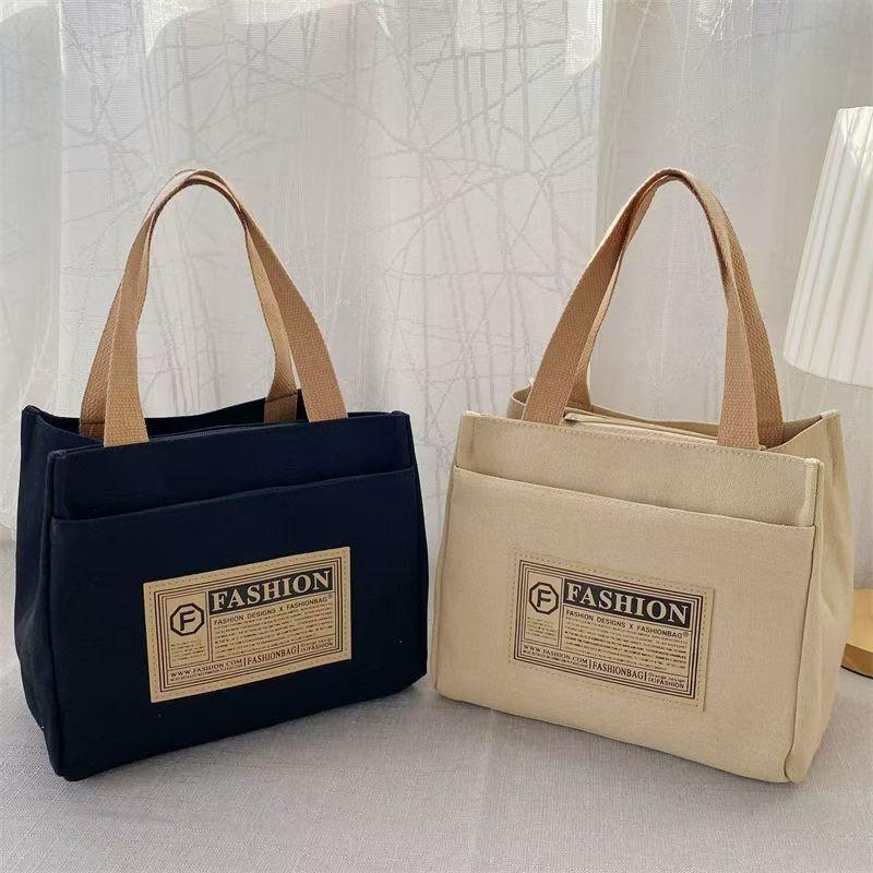 High-value canvas handbag, simple and portable for office workers, casual handbag, lunch box, and handbag.