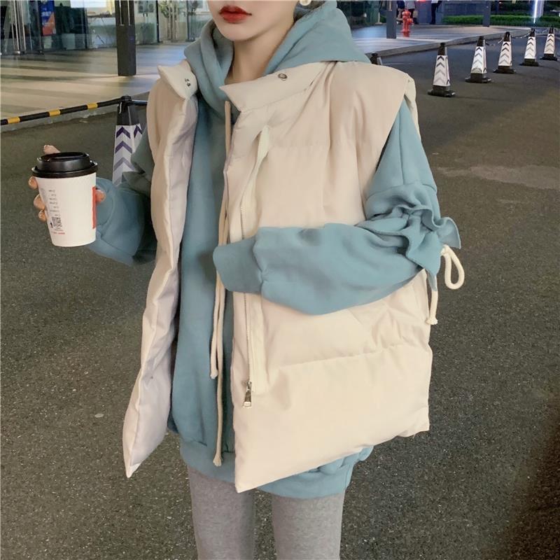 Women Wearing Vests and Jackets Outside